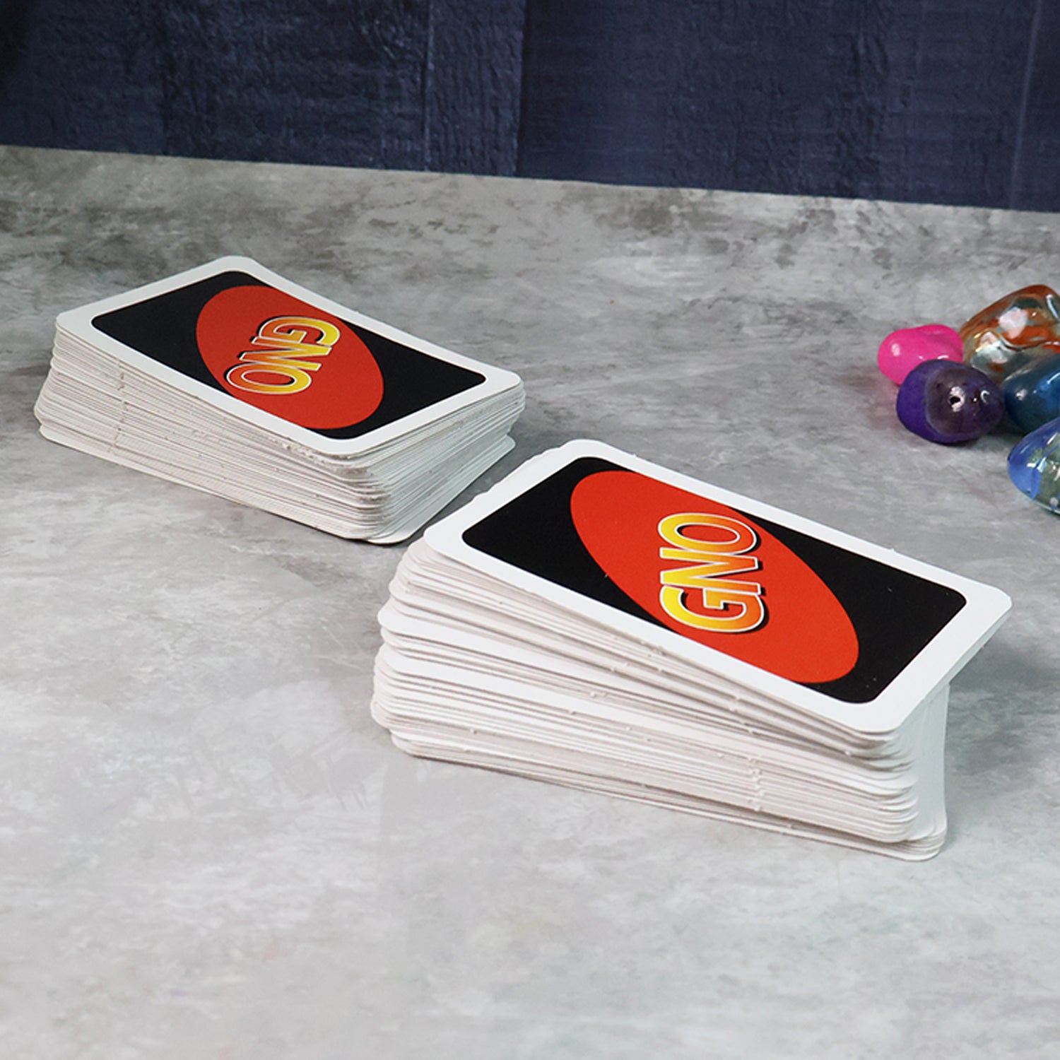 Wukusy Gno Pixar Anniversary Card Game with 112 colorful toy cards featuring Pixar characters and artwork.
