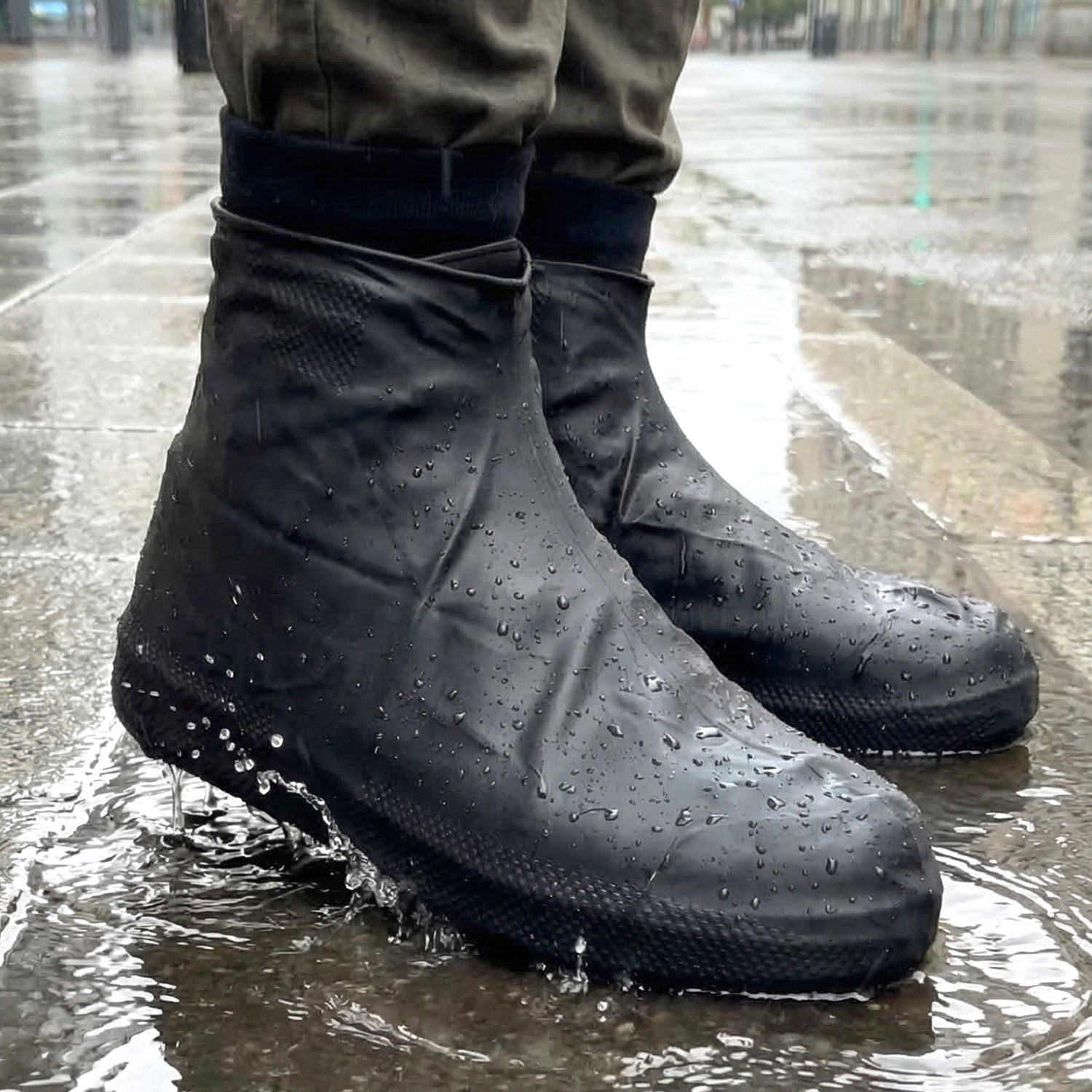 Pair of large waterproof silicone shoe covers by Wukusy, designed to protect footwear from water and dirt.