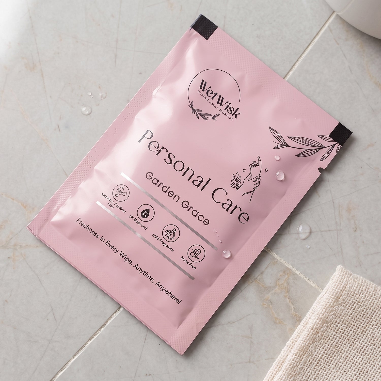 Wukusy personal care wet wipe for gentle cleansing, shown as a single soft, moist wipe in the image.