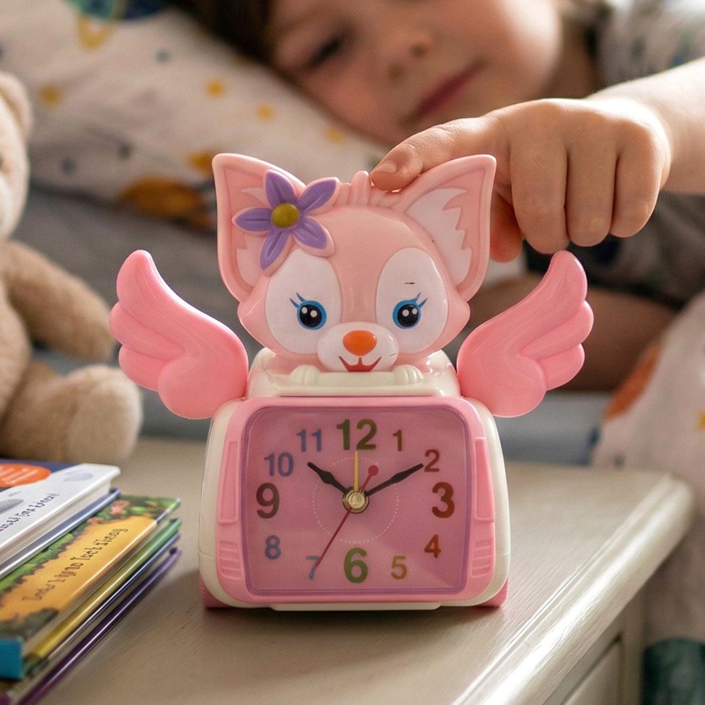 Wukusy angel cat-themed kids alarm clock featuring a cute angel design with colorful details and playful appearance.