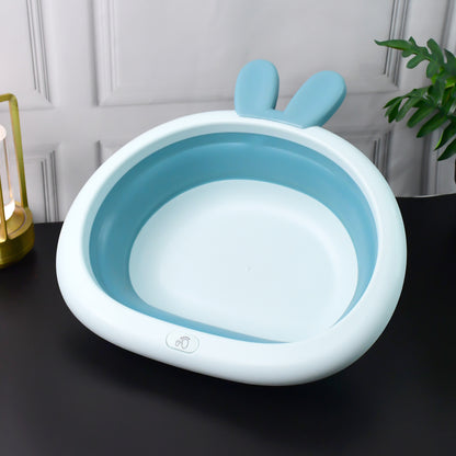 Foldable Wukusy baby care basin with bunny ear handle, collapsible design for easy storage and transport.