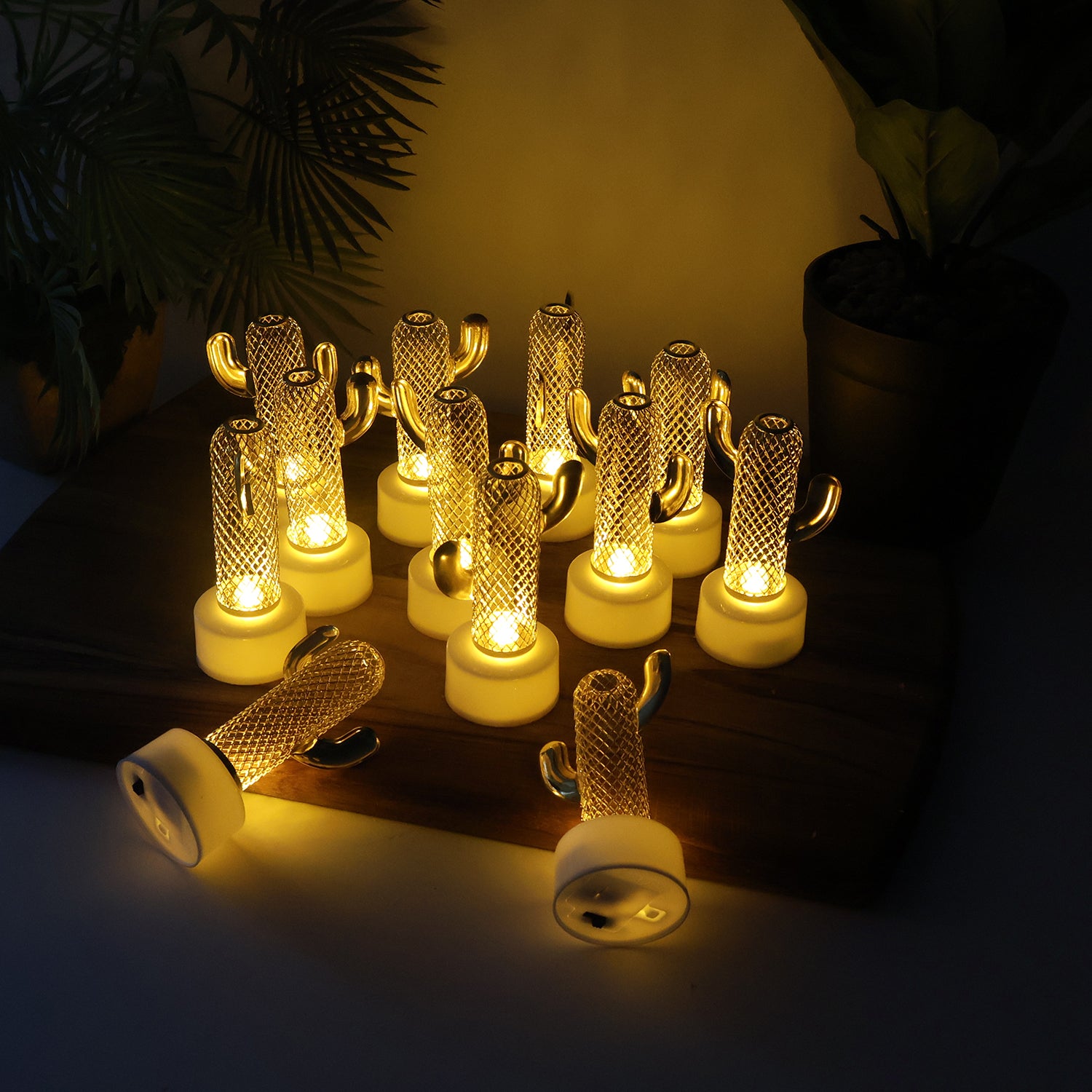 Set of 12 Wukusy decorative cactus-shaped flameless LED candles for home decor, featuring cactus designs and warm LED lighting.