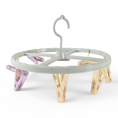 Wukusy clothespin rack laundry drying rack with multiple metal bars for hanging clothes and clothespins.