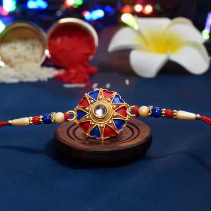 Colorful traditional designer Rakhi from Wukusy, featuring intricate thread designs for festive occasions.
