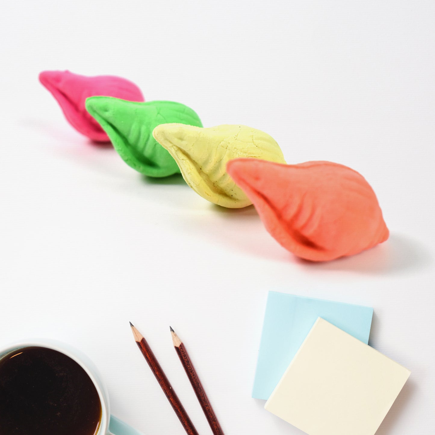 Wukusy Shankh Shape Eraser Rubber in mix colors, designed for office use, featuring a shell-like shape and vibrant pattern.