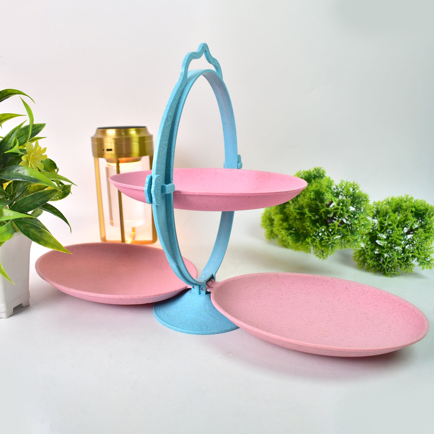 Foldable Wukusy fruit plate and candy dish in mirror shape, multi-use dried fruit tray shown on a kitchen countertop.