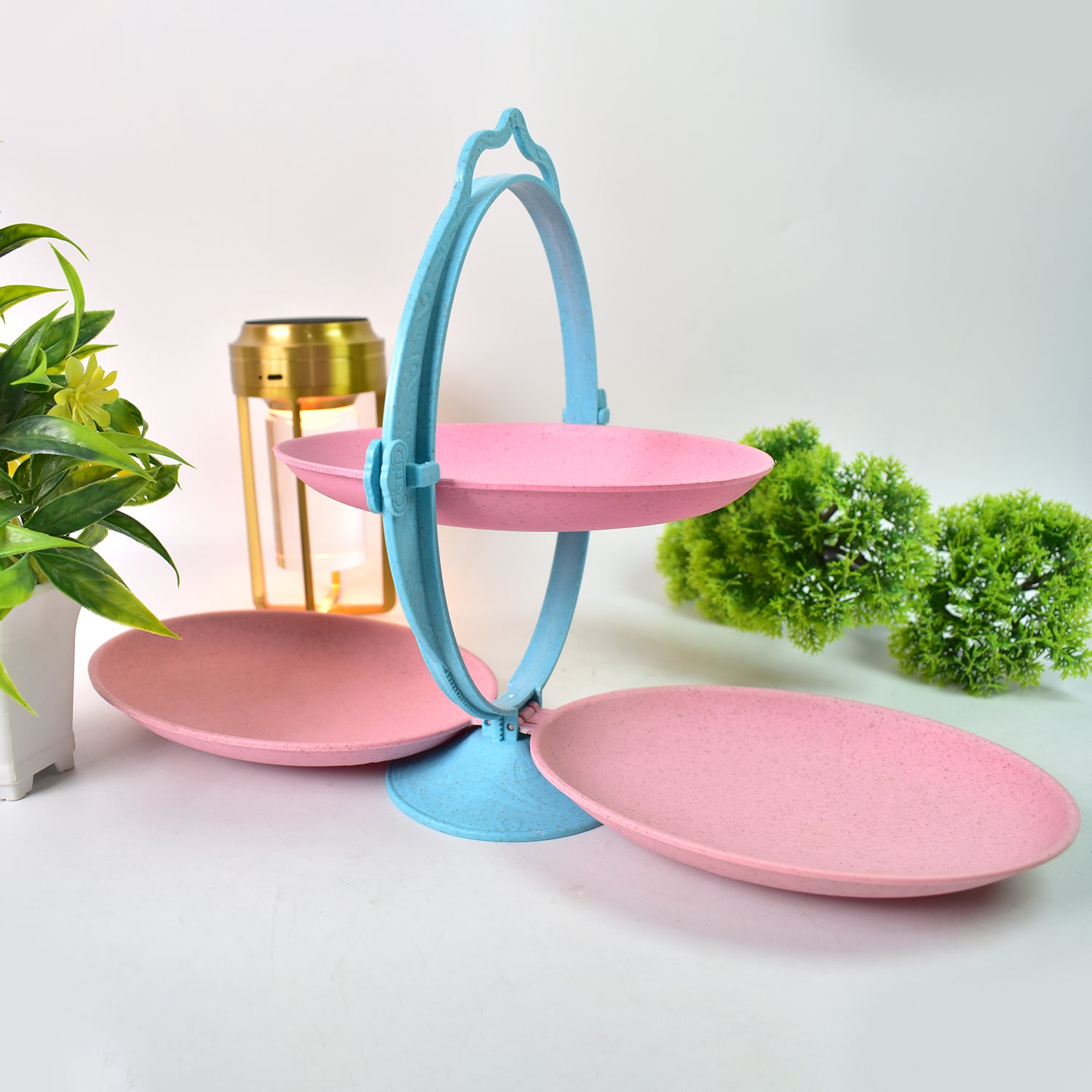 Foldable Wukusy fruit plate and candy dish in mirror shape, multi-use dried fruit tray shown on a kitchen countertop.
