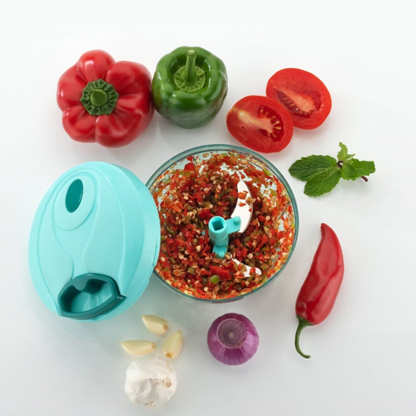 Wukusy Handy Mini Plastic Vegetable Chopper with three blades for chopping onions and vegetables in the kitchen.