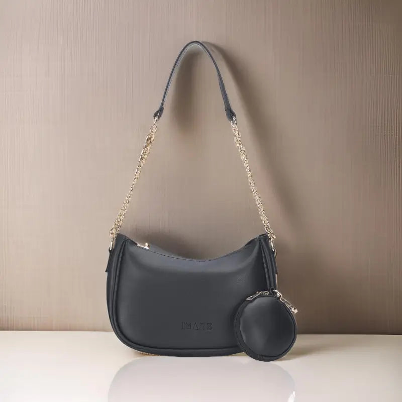 Small black vegan leather shoulder bag by Ekom featuring a classic chain strap for women and girls.