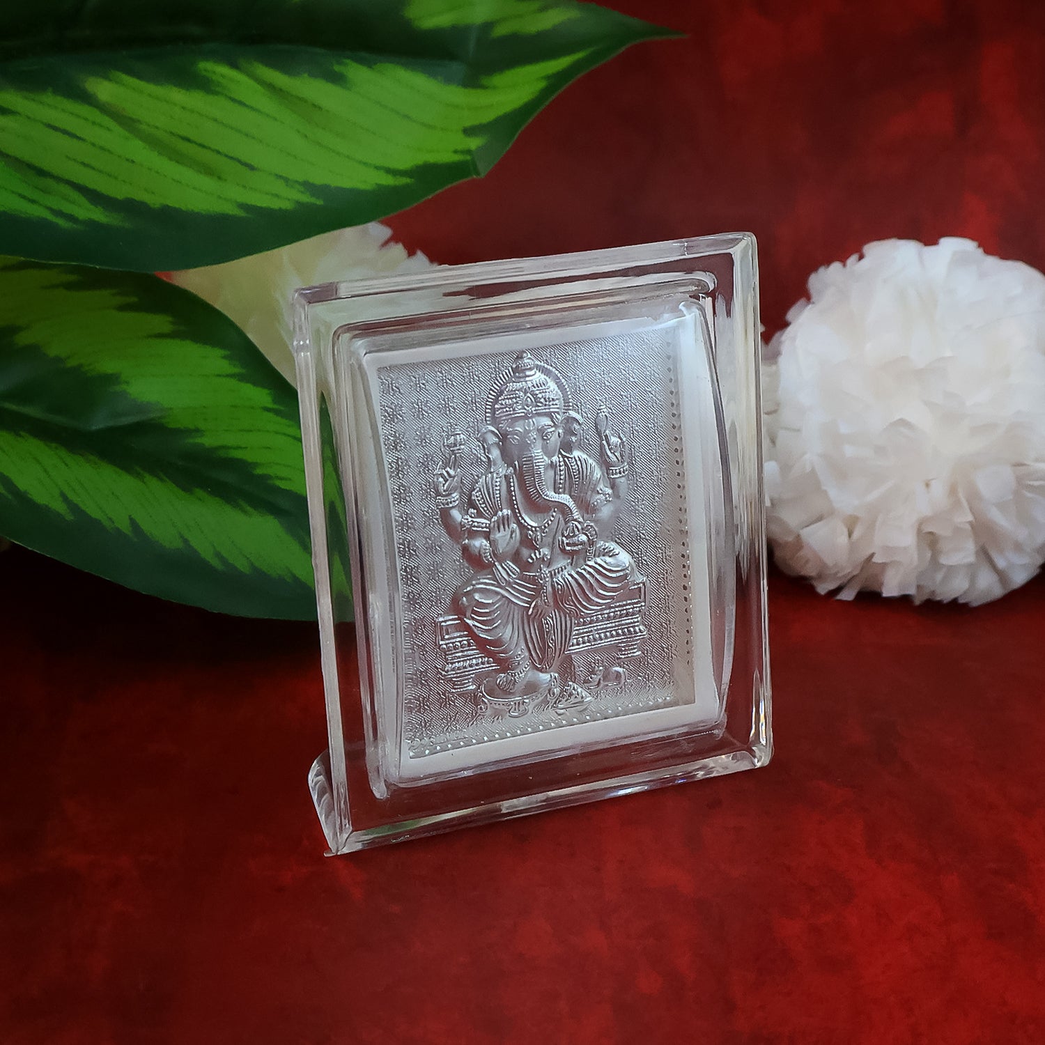 Silver-plated Lord Ganesha embossed photo frame by Wukusy, decorative home decor with intricate Ganesha design.