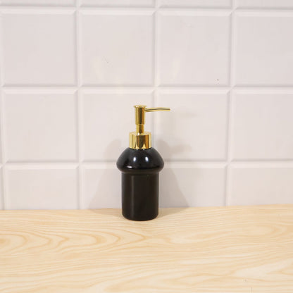 Black glass liquid soap dispenser bottle with gold pump from Wukusy, refillable, elegant bathroom or kitchen accessory.
