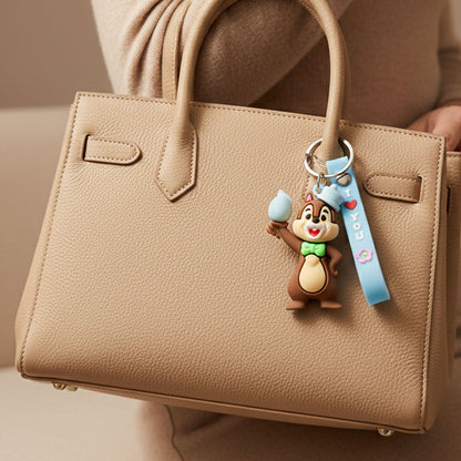Cute cartoon squirrel character keychain by Wukusy, featuring a detailed, colorful squirrel design with a keyring attachment.