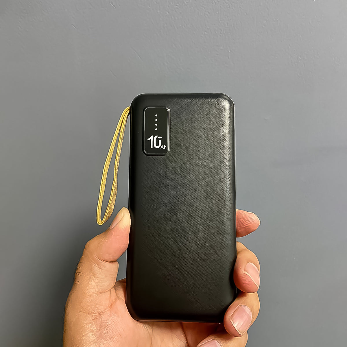Wukusy 10000mAh fast charging power bank with 12W output, built-in 4-in-1 USB ports, and mobile holder in an electronics image