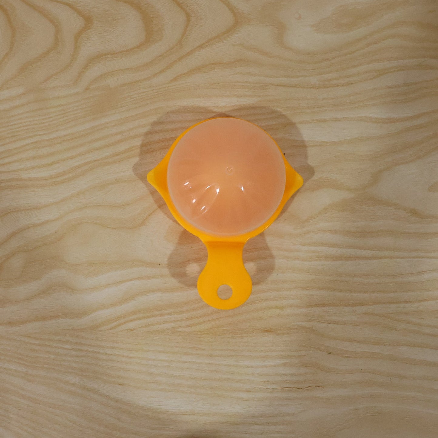 Yellow Wukusy manual citrus juicer for lemons and oranges, hand-operated squeezer for home use, compact and easy to use.
