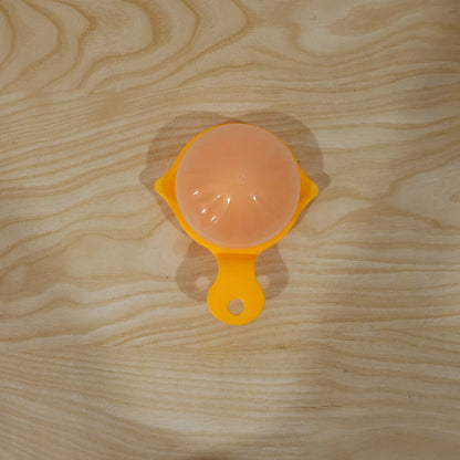 Yellow Wukusy manual citrus juicer for lemons and oranges, hand-operated squeezer for home use, compact and easy to use.
