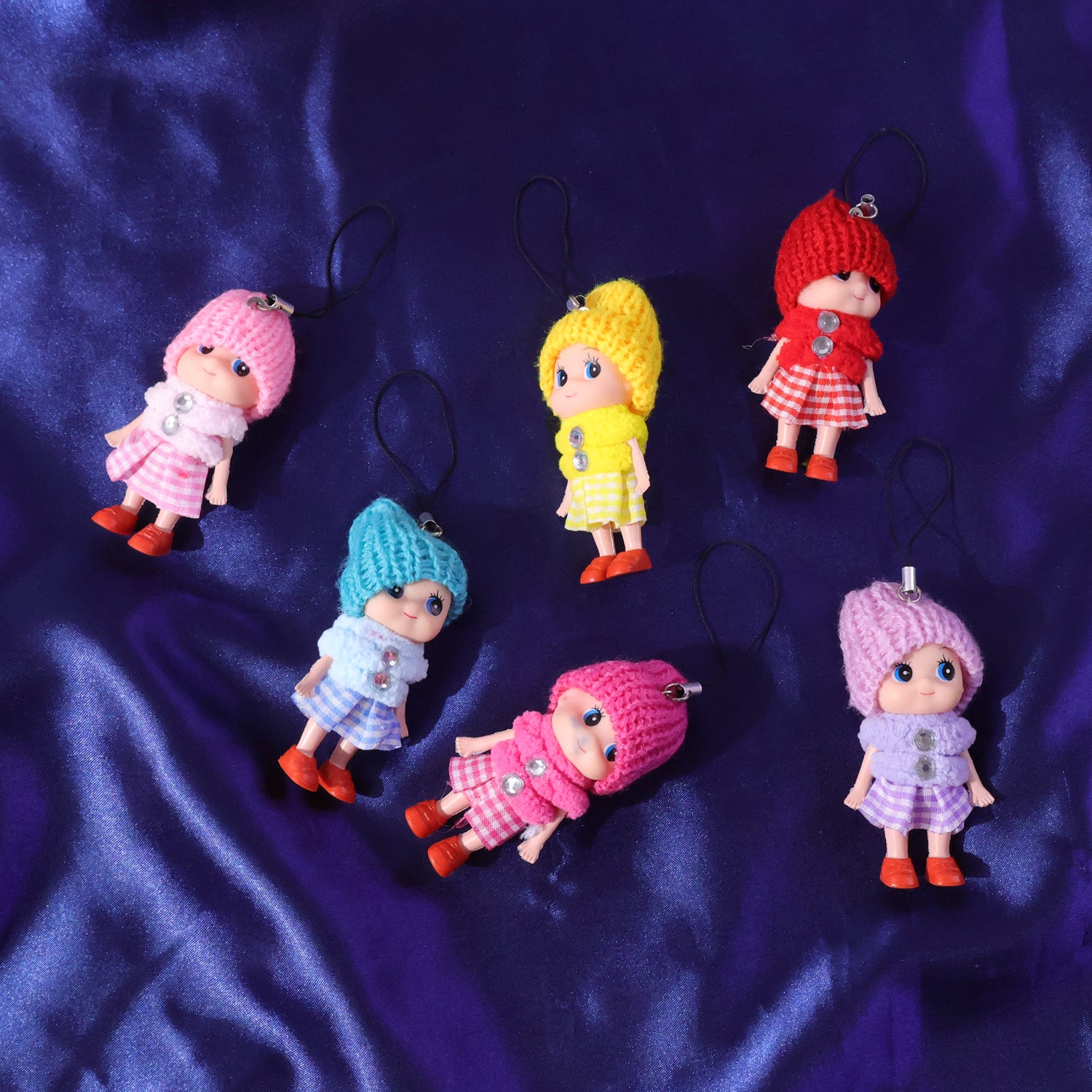 Six colorful Wukusy mini doll hanging keychains in various mixed colors displayed on a white background.