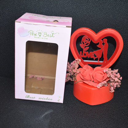 Heart-shaped love couple decorative showpiece with rose base, Wukusy home decor item, featuring a romantic design and intricate details.