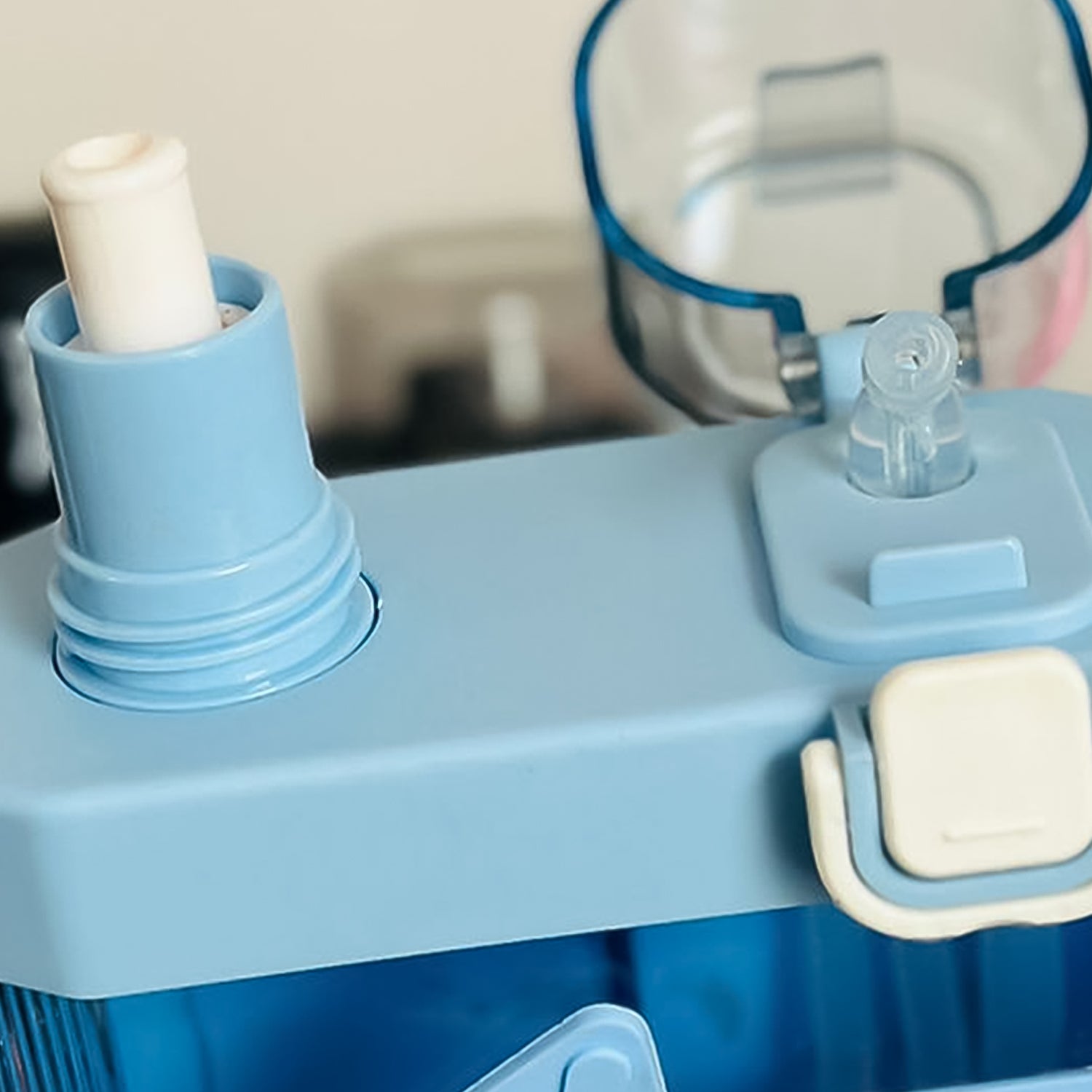 Multi-color Wukusy 2-in-1 dual compartment water bottle with straw and adjustable shoulder straps, designed for convenient hydration.