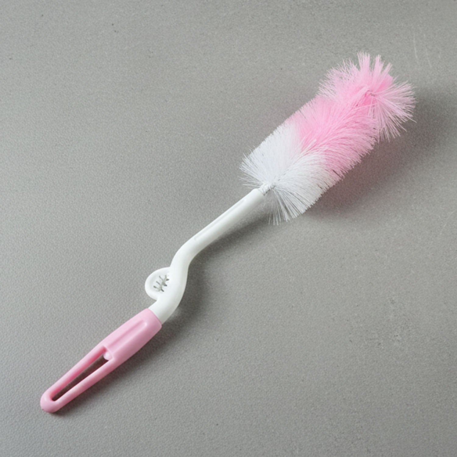 Wukusy bottle nipple cleaning brush with 360 rotary handle, designed for thorough cleaning of baby bottle nipples.