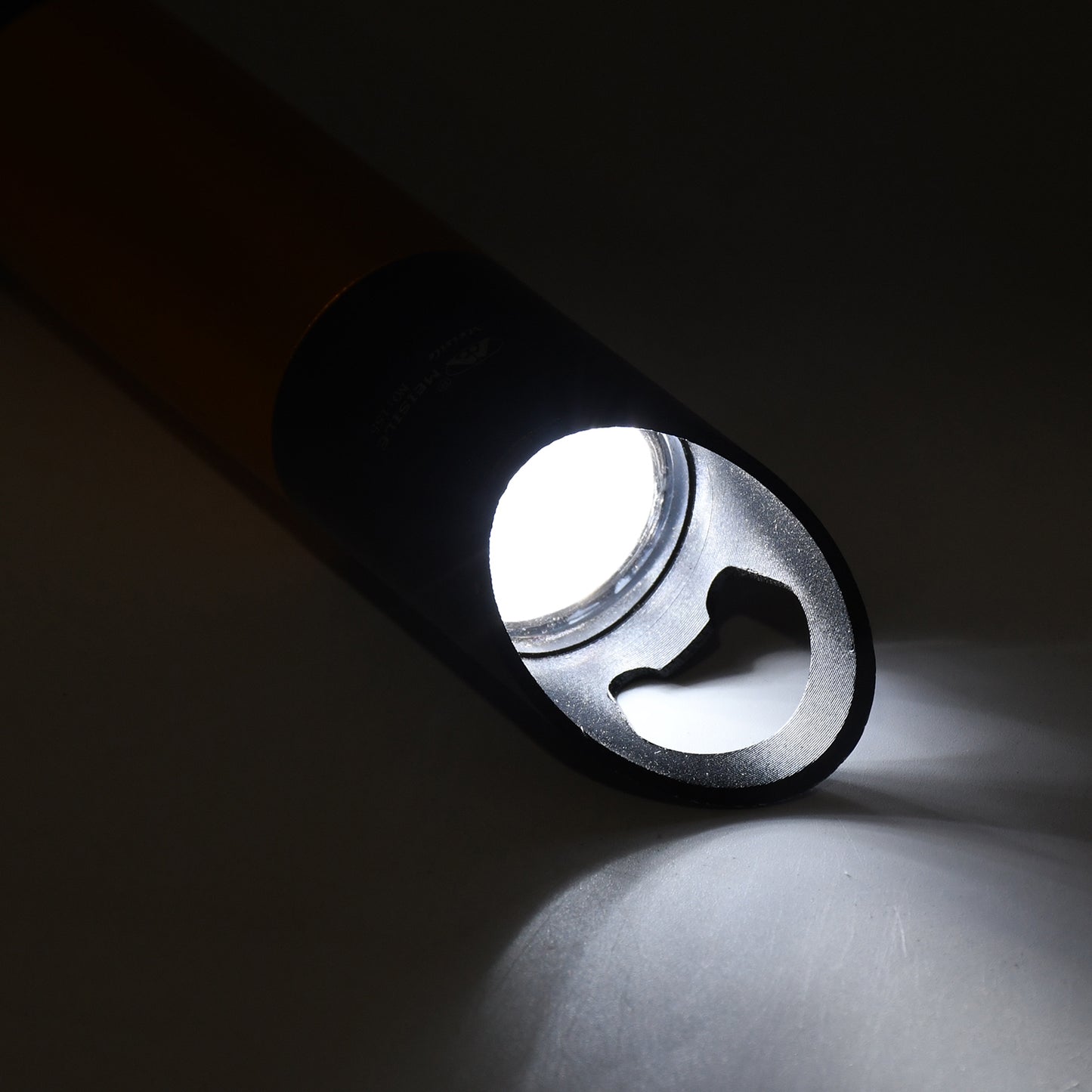 Wukusy portable mini torch flashlight with 9 LED bulbs, compact design, high lumens, powered by 3 batteries (not included).