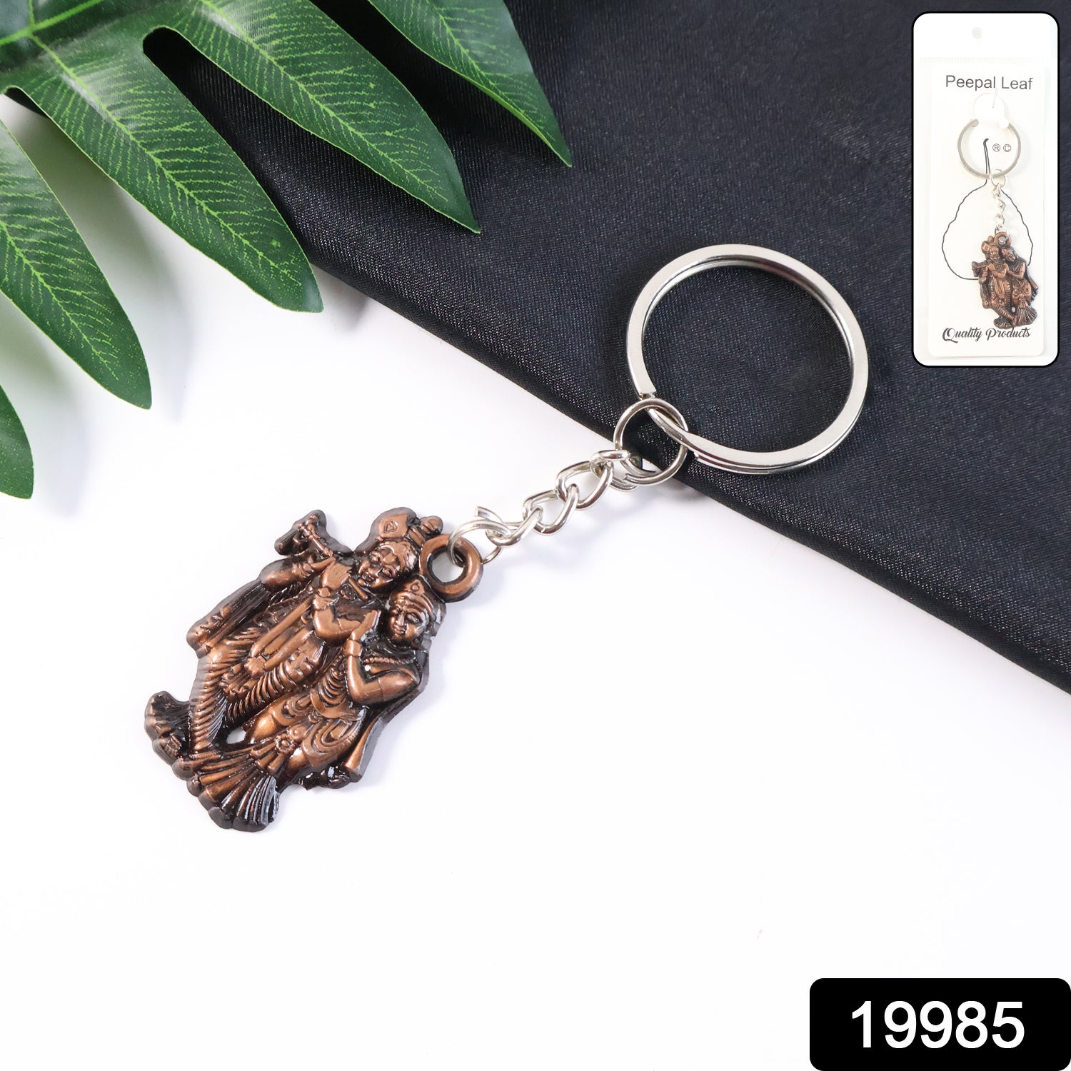 Radha Krishna metal keychain by Wukusy featuring detailed religious iconography on a small, decorative keychain.