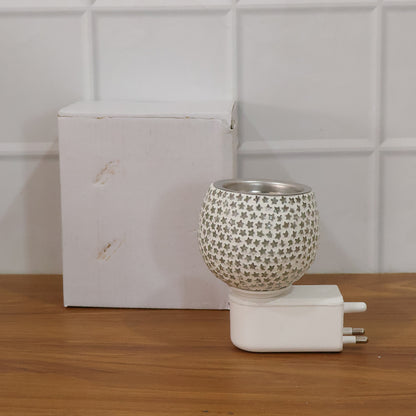 Wukusy plug-in star-shaped glass aroma diffuser night lamp with soft lighting and aromatic diffuser in a modern home decor setting.