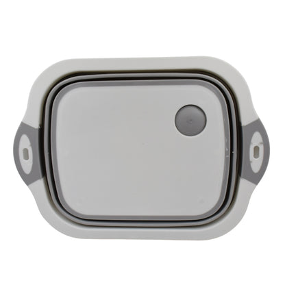 Wukusy collapsible cutting board with integrated dish tub basket on a kitchen countertop, portable and space-saving for food prep.