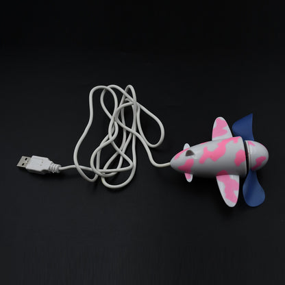 Wukusy 7721 plane-shaped USB fan with unique design, energy-saving desktop fan for laptops and computers.