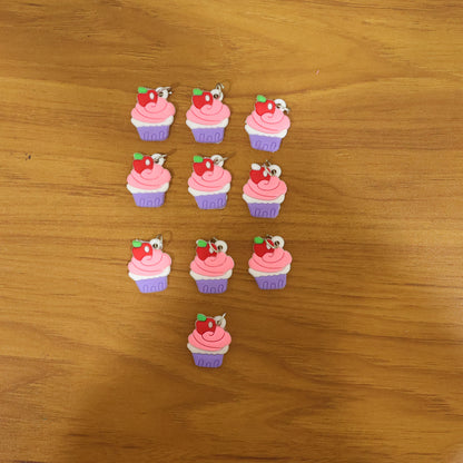 Set of 10 Wukusy cupcake-shaped bag charm keychains featuring colorful, cute cupcake designs on a keyring.