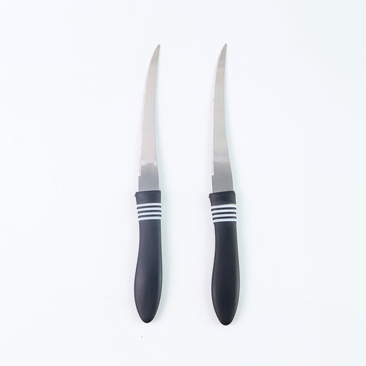 Wukusy premium curved serrated stainless steel kitchen knife set with two colorful knives on a wooden surface