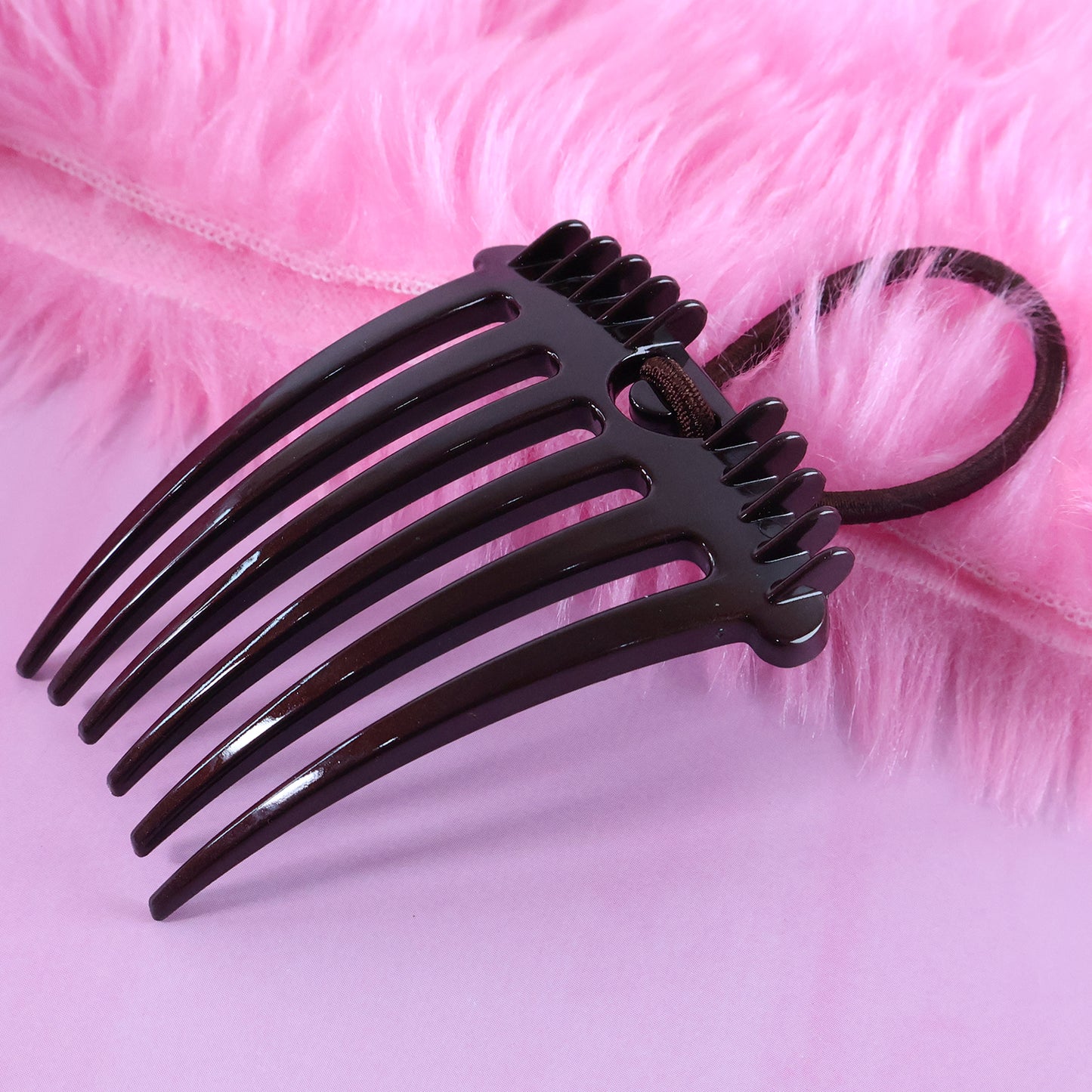 Wukusy ponytail comb with elastic loop for secure hair styling, shown in close-up on a white background.