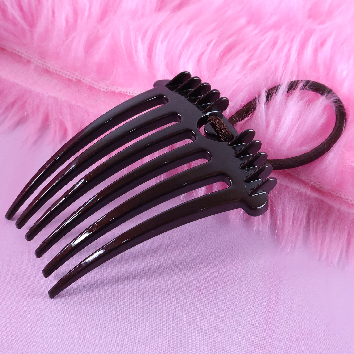 Wukusy ponytail comb with elastic loop for secure hair styling, shown in close-up on a white background.