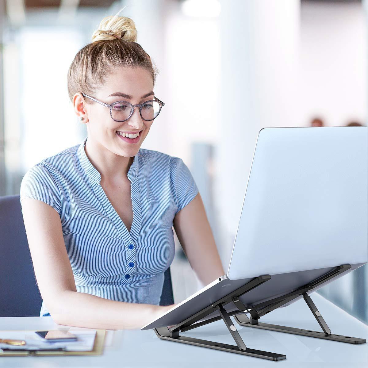 Wukusy 1320 adjustable office laptop stand with foldable legs and high-quality fiber surface, supporting ergonomic workspace setup.