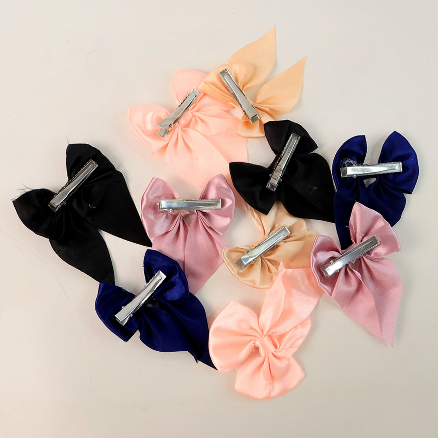 Set of 10 Wukusy satin bow hair clips for girls and women, featuring colorful, shiny satin bows on alligator clips.