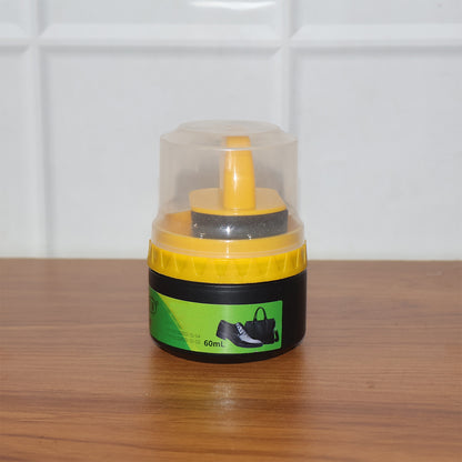 Wukusy black shoe polish cream with built-in sponge applicator, 60 ml, showing the compact jar and applicator for shoe shining.