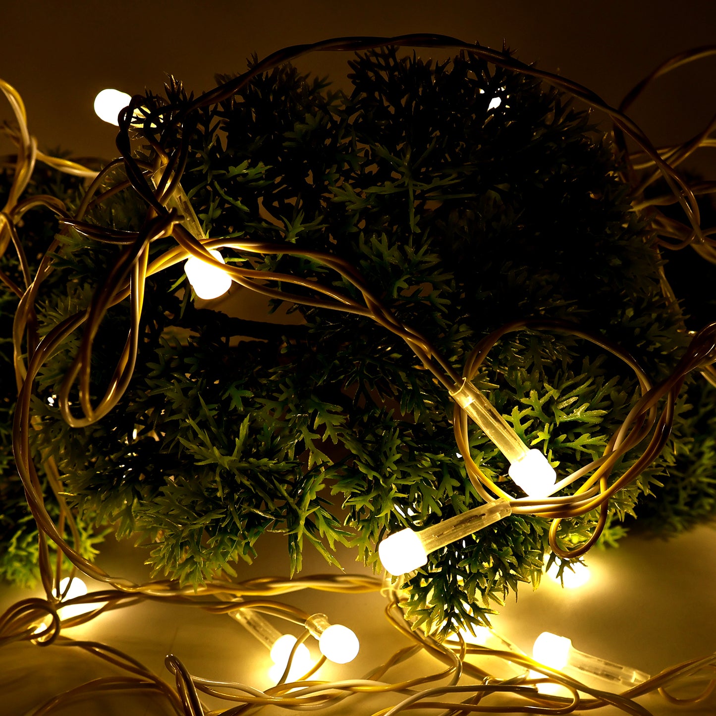 Wukusy 10-meter LED decorative string fairy lights for home decor, featuring warm glowing bulbs on a flexible wire.