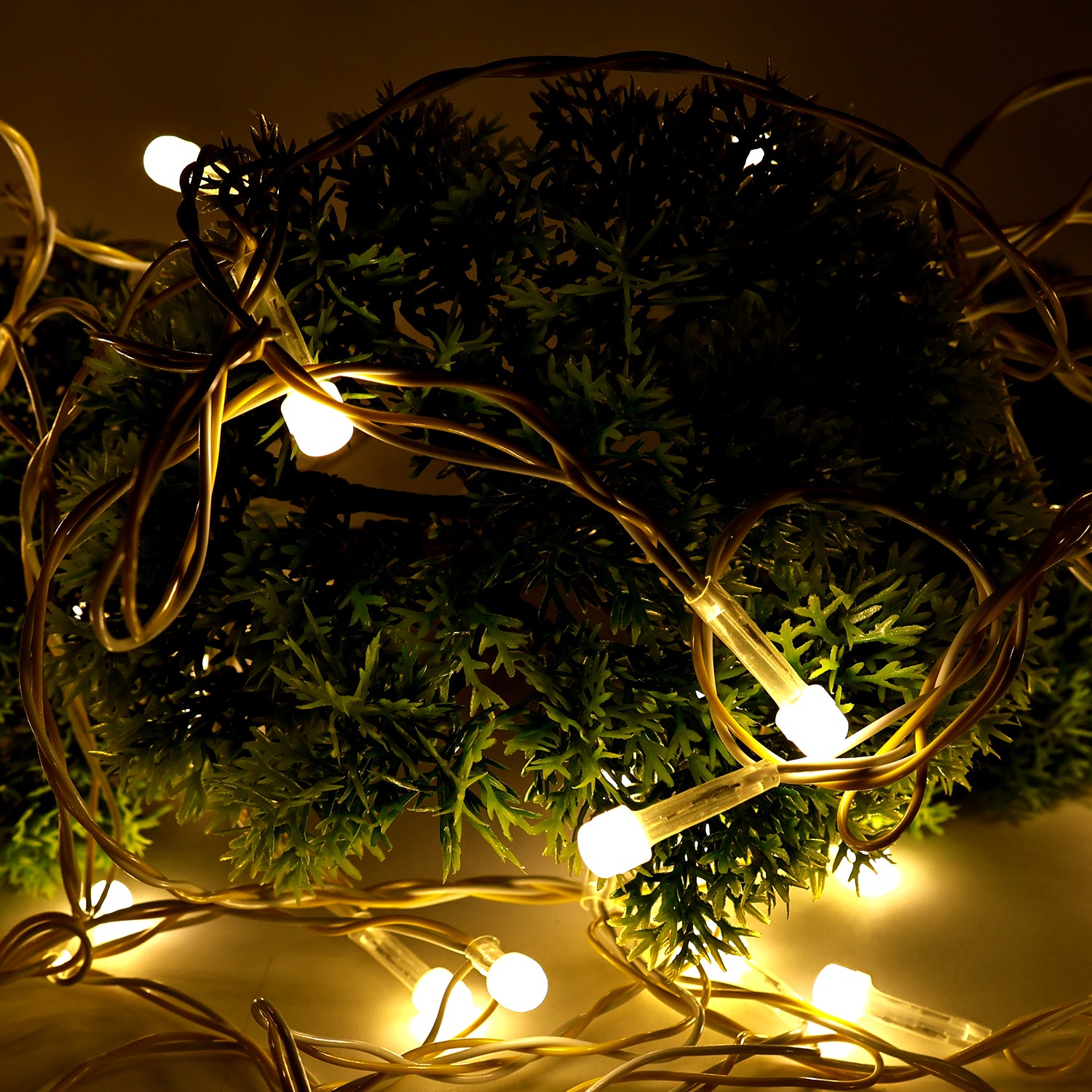 Wukusy 10-meter LED decorative string fairy lights for home decor, featuring warm glowing bulbs on a flexible wire.