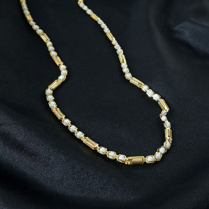 Gold-tone designer chain necklace by Wukusy featuring a sleek, stylish link design on a white background.