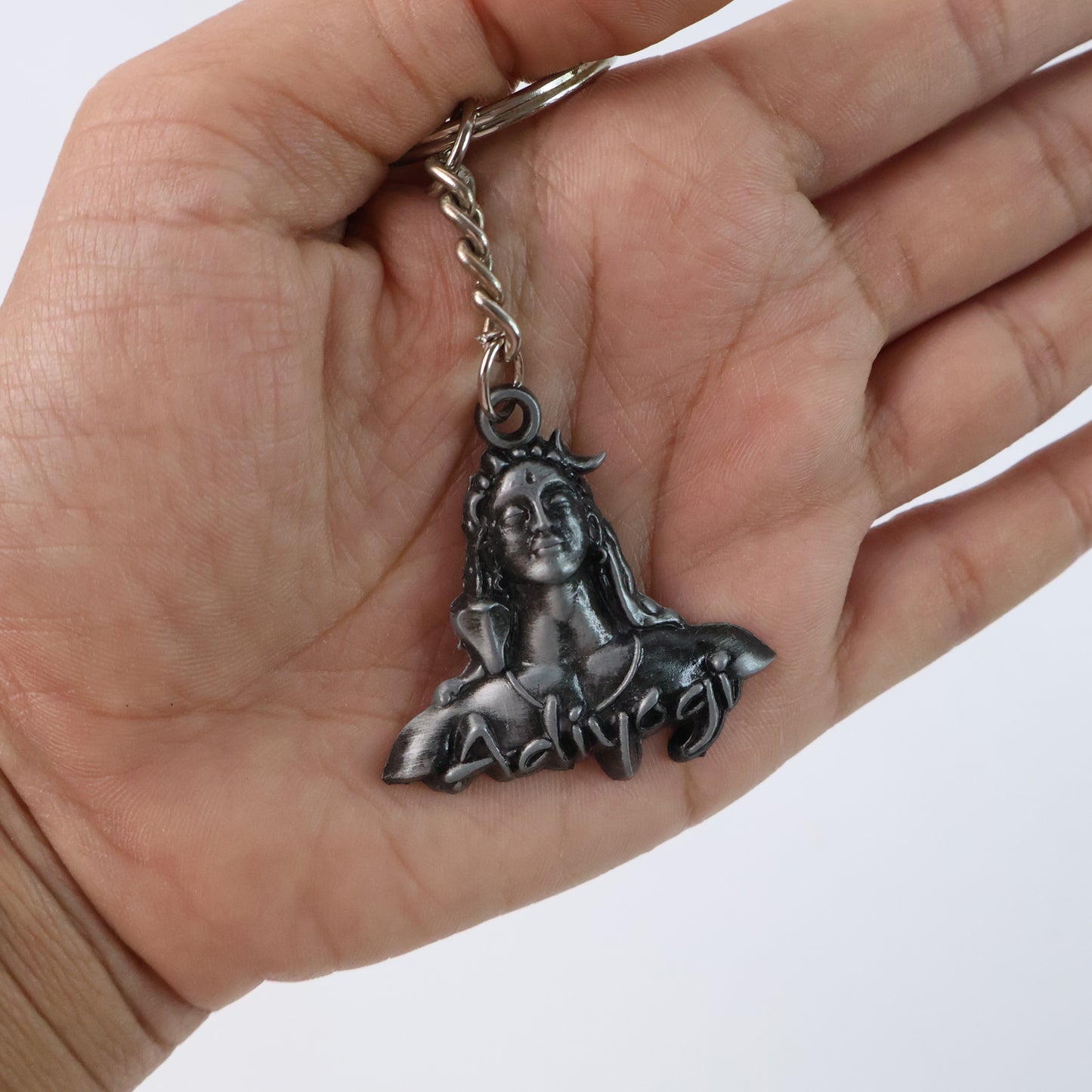 Wukusy Adiyogi Shiva face metal keychain featuring intricate design and detailed sculpture, ideal for accessories or key organization.