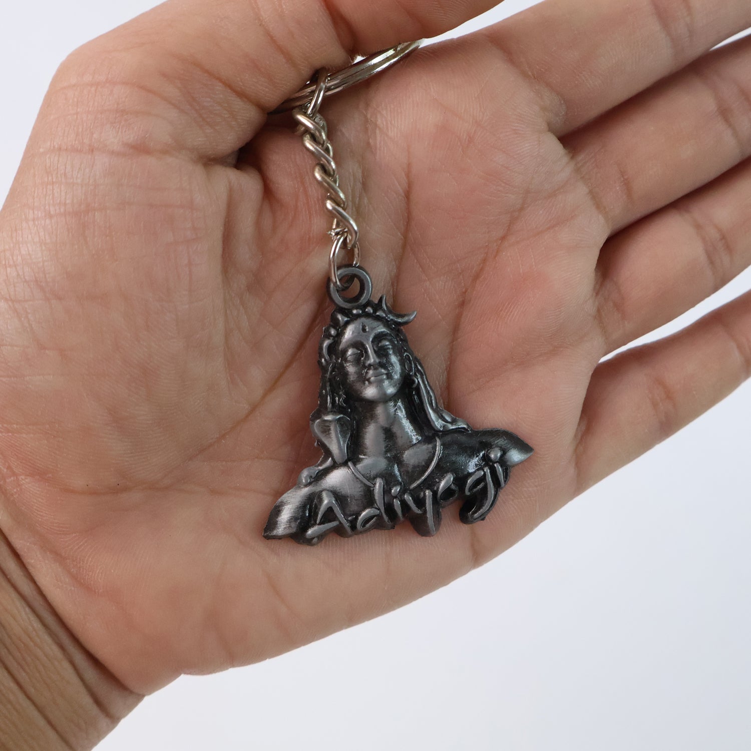 Wukusy Adiyogi Shiva face metal keychain featuring intricate design and detailed sculpture, ideal for accessories or key organization.