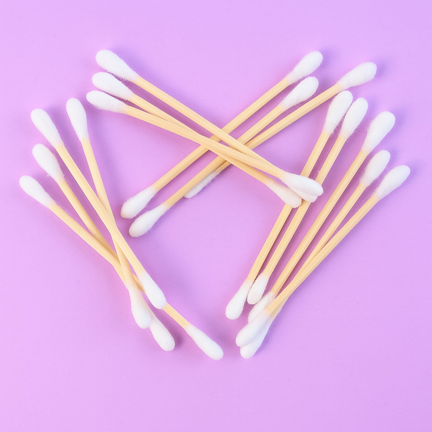 Wukusy eco-friendly wooden cotton ear buds in a transparent plastic packaging, 100 pcs, with wooden and cotton tips.