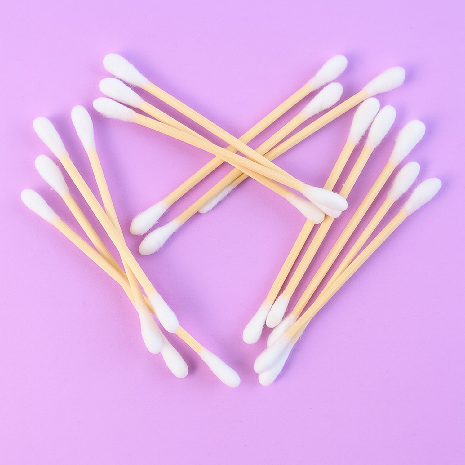 Wukusy eco-friendly wooden cotton ear buds in a transparent plastic packaging, 100 pcs, with wooden and cotton tips.