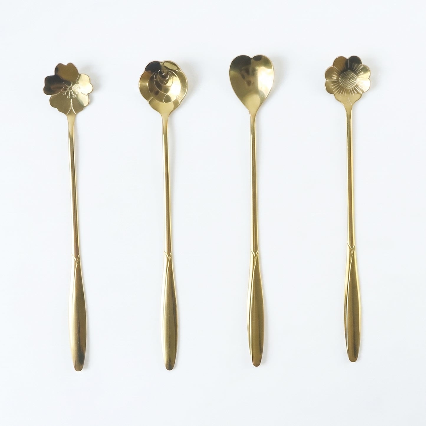 Set of four Wukusy golden mini steel serving spoons for desserts, tea, and coffee, ideal for home use.