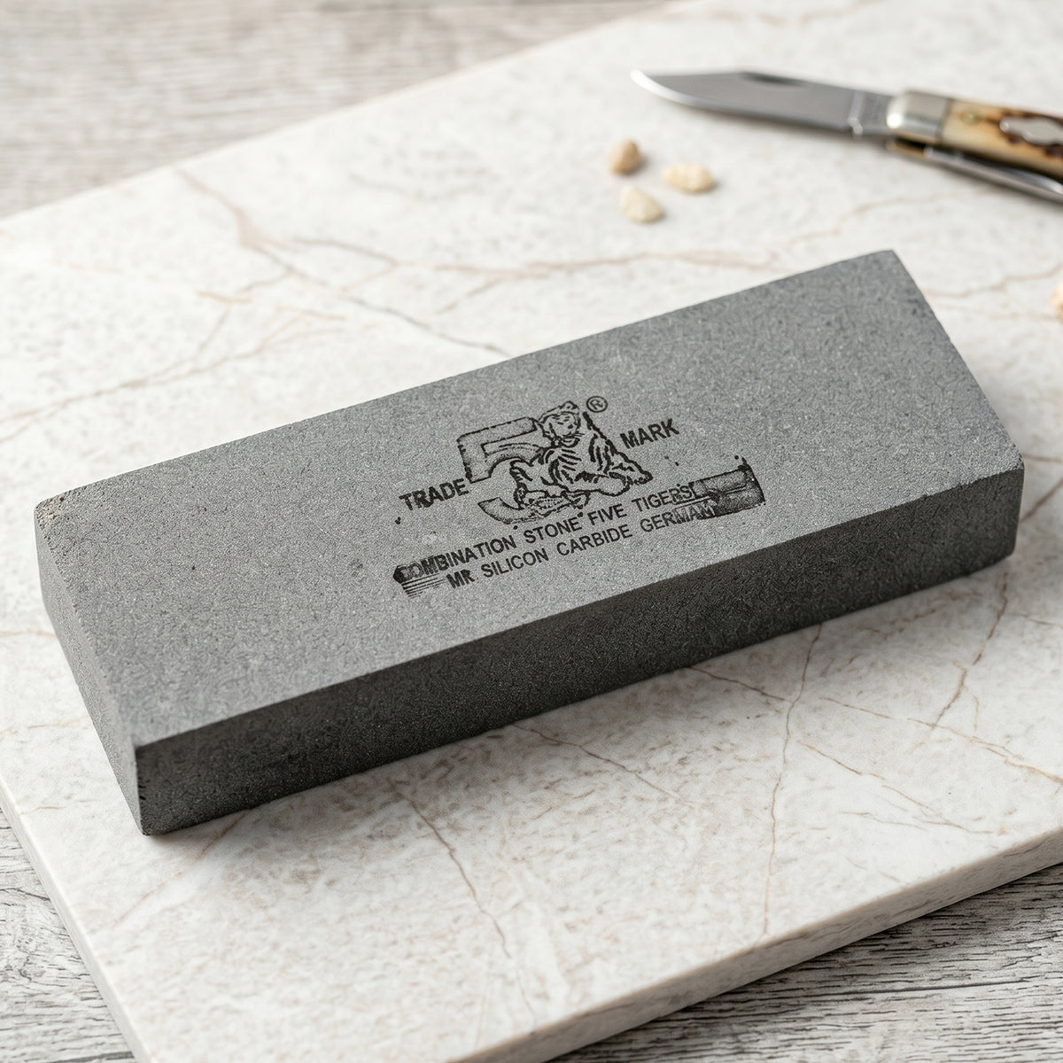 Wukusy silicon carbide combination whetstone for knife sharpening, featuring coarse and fine grit surfaces in a single stone.