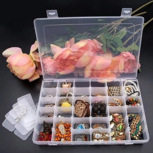 Wukusy 7673a clear plastic jewelry organizer box with 36 grids and adjustable dividers for home storage, transparent and compact.