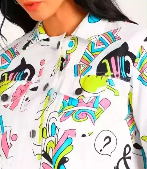 Women’s printed denim jacket by Ekom, casual outerwear with colorful floral print and classic denim design.