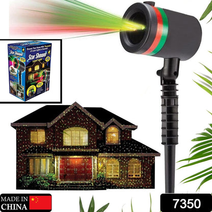 Wukusy 7350 Star Fairy Motion Laser Lights projector displaying colorful star patterns on a garden lawn for outdoor decor.