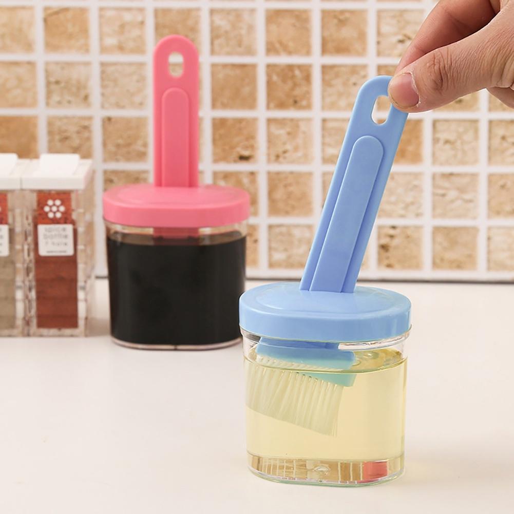 Wukusy 2429 multi-purpose silicone spatula with holder, durable kitchen tool, black handle and flexible silicone head.