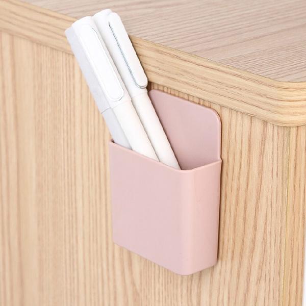 Set of four Wukusy wall-mounted storage cases with mobile phone charging ports, designed for organizing and charging devices.