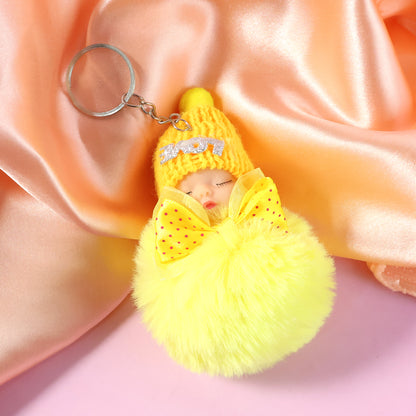 Wukusy cute plush doll keychain with soft fur ball, featuring a charming, huggable design for keys or bags.